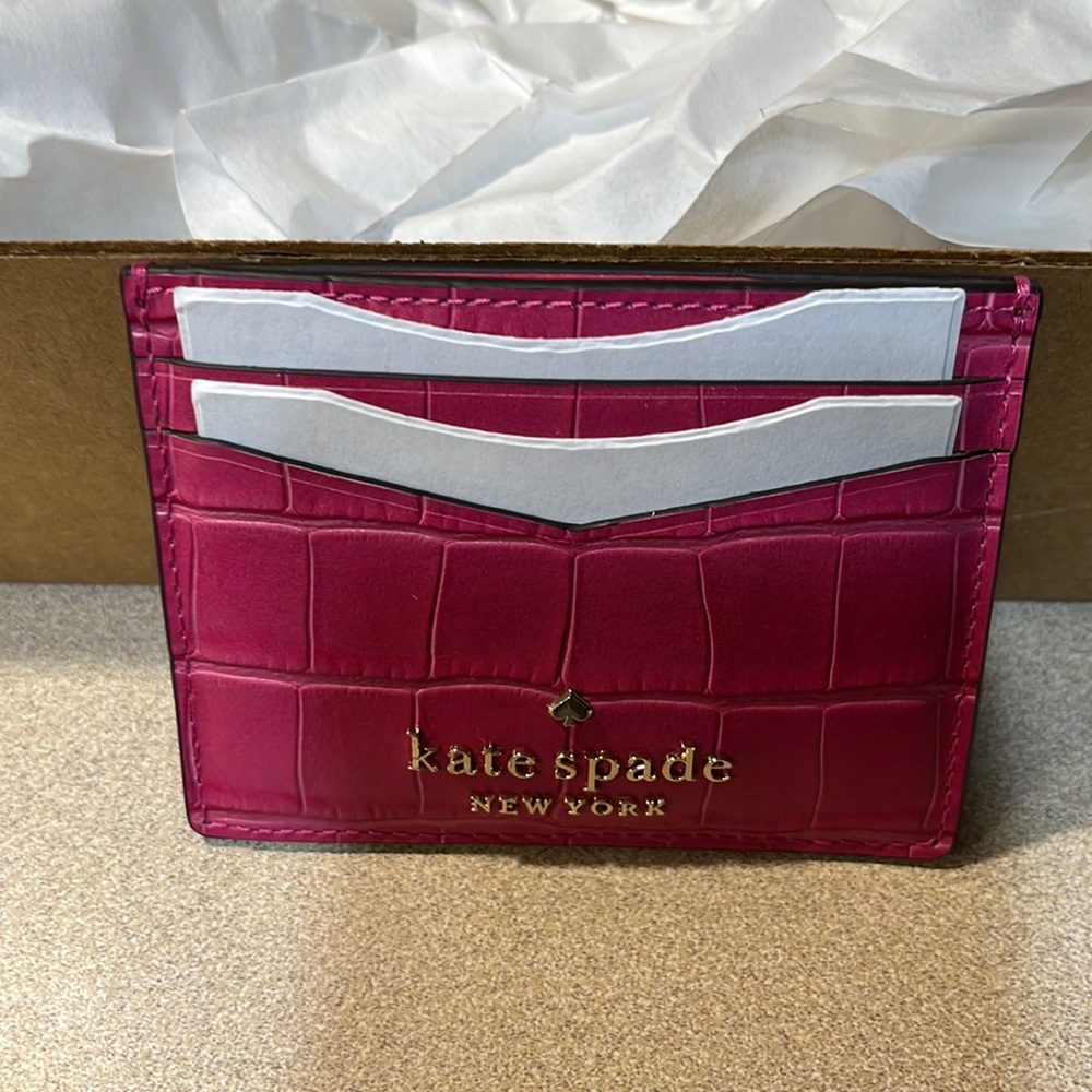 Kate Spade alligator style 4 slots and a middle compartment credit card holder.